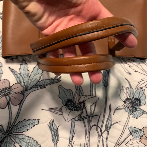 Classic tan faux leather tote with gold tone bit hardware and tassel details. - Picture 4 of 5